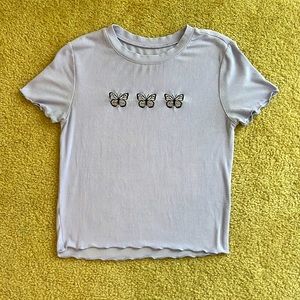 Purple shirt with butterfly design